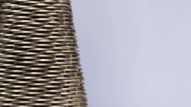 Close up of rotating structure made of golden coins - Footage, Video
