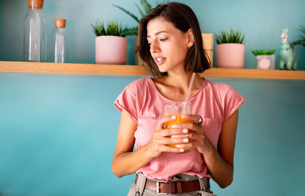 Beautiful young woman drinking fresh raw juice. Healthy Lifestyle - Zdjęcie, obraz