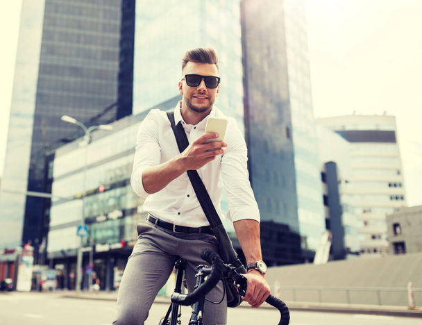 man with bicycle and smartphone on city street - Foto, Imagem
