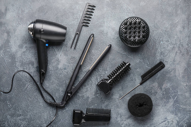 Modern hairdresser tools on grey background - Фото, изображение