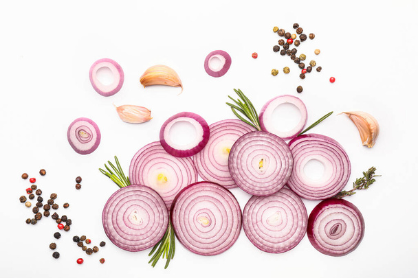 Fresh raw onion and spices on white background - Photo, Image