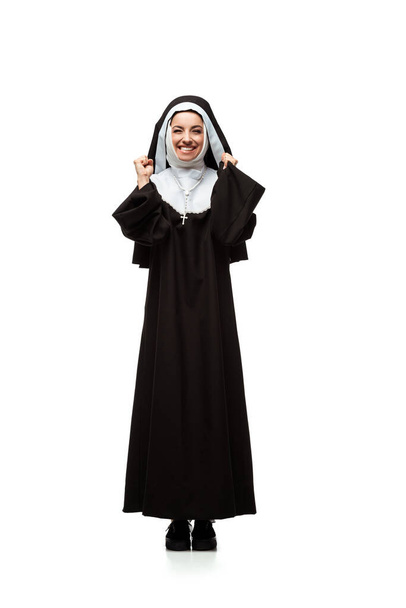 beautiful young excited nun standing isolated on white    - Fotoğraf, Görsel