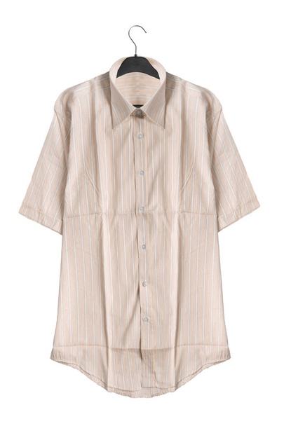 Beige striped oversized shirt hanging on black clothes rack isolated over white - Фото, зображення