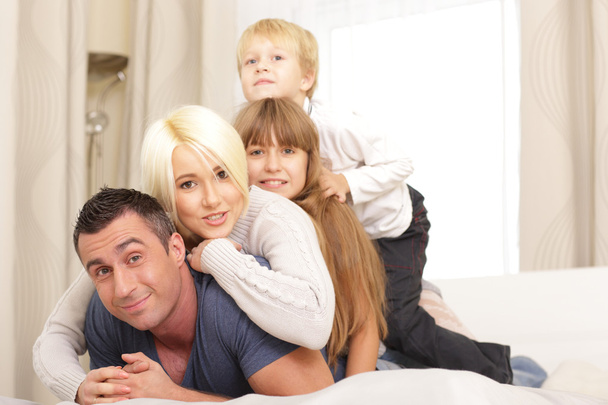 Family lying on top of each other - Photo, Image