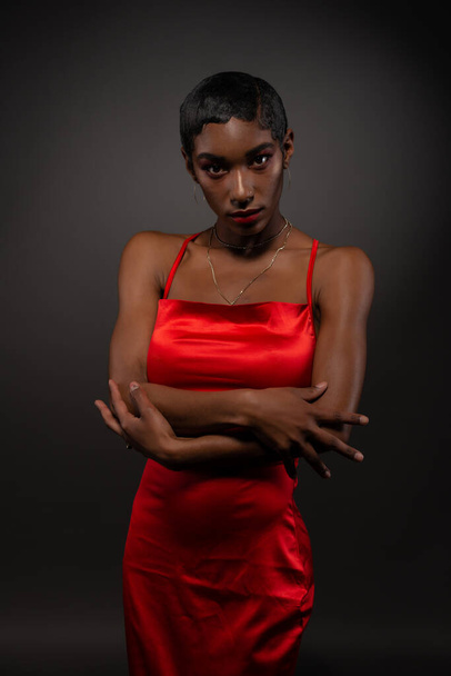 Slender young African American woman in a tight red dress - Valokuva, kuva