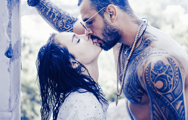 Passion love couple. Romantic moment. Handsome muscular guy and amazing sexy woman. Cosmopolitan couple. Love and flirt. Muscular man and fit slim young female kissing. Couple goals. - Φωτογραφία, εικόνα