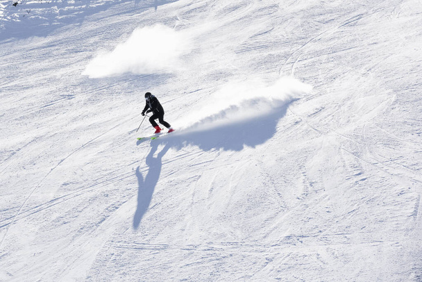  Bulgaria. Bansko. 14 February 2020.skier riding down the huge snowfield splashing powder snow - Zdjęcie, obraz