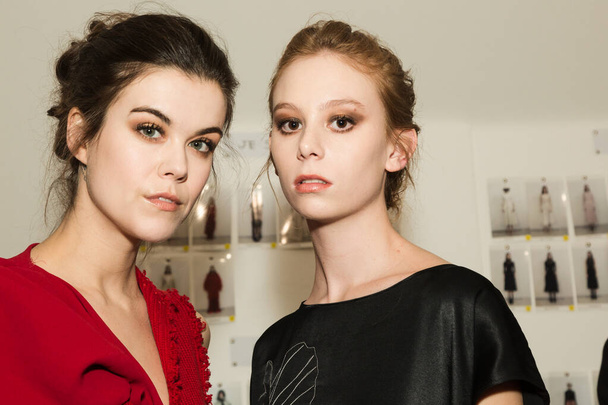 MILAN, ITALY - FEBRUARY 21: Gorgeous models pose in the backstage just before Budapest Select show during Milan Women's Fashion Week on FEBRUARY 21, 2020 in Milan. - Zdjęcie, obraz