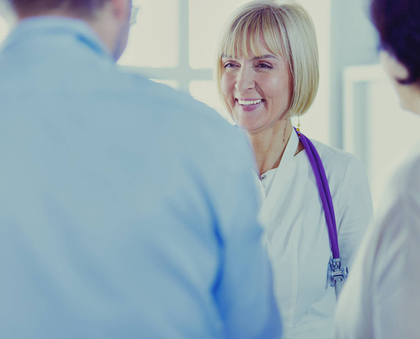 friendly female medical doctor talking with patient - Foto, immagini