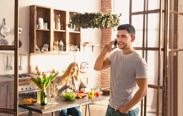 Romantic morning. Young couple spending time together in kitchen, empty space - Foto, Bild