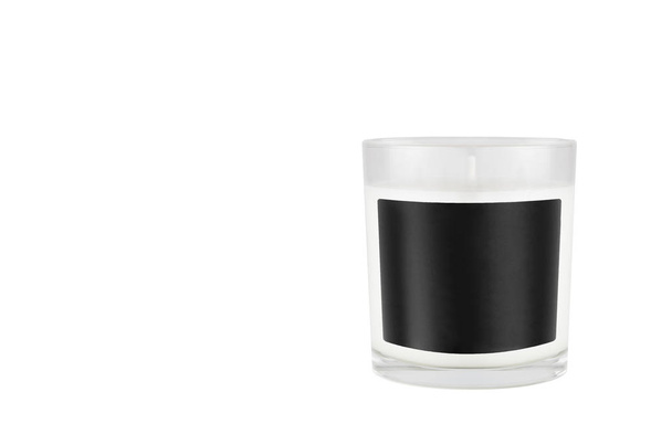 White candle in transparent glass with black blank label on isolated, mock up for branding identity of product, advertising, presentation, design packing. - Fotó, kép