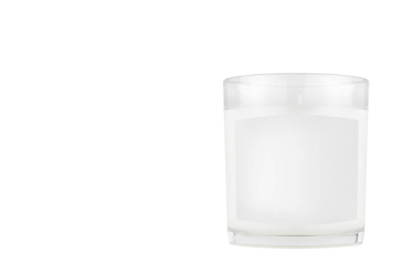 White candle in transparent glass with white blank label on isolated, mock up for branding identity of product, advertising, presentation, design packing. - Foto, immagini