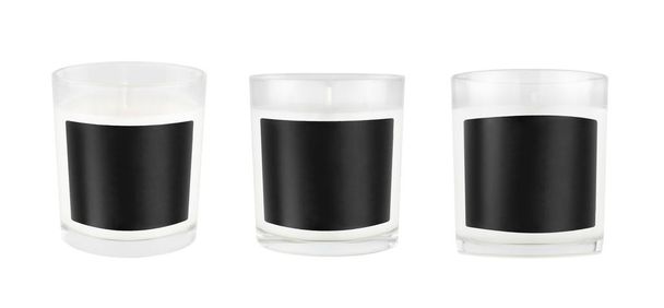 Three white candles in transparent glass with black blank label on isolated, mock up for branding identity, advertising, presentation, design packing. - Foto, immagini