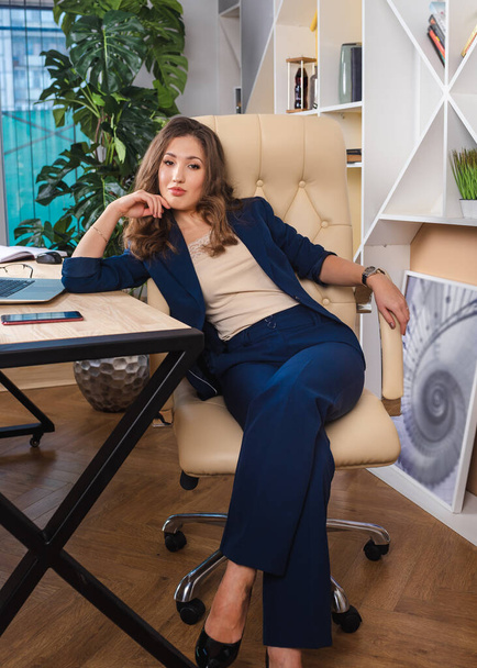 business woman in an office chair resting - 写真・画像