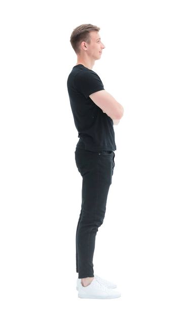 side view. a confident young man in a black t-shirt - Φωτογραφία, εικόνα