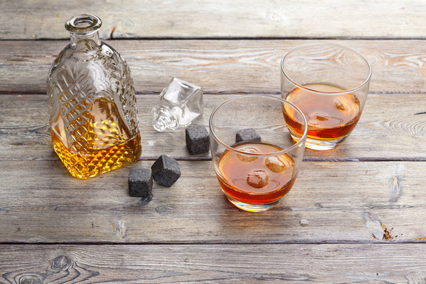 Whiskey beverage in glass with stone. Alcohol background - Φωτογραφία, εικόνα