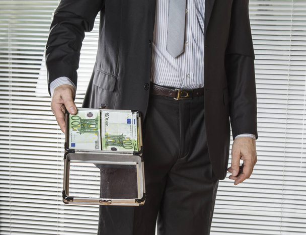 Successful businessman showing his cash money - Photo, Image