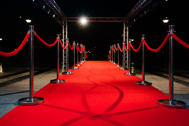 Red carpet with barriers and red ropes. - Photo, Image