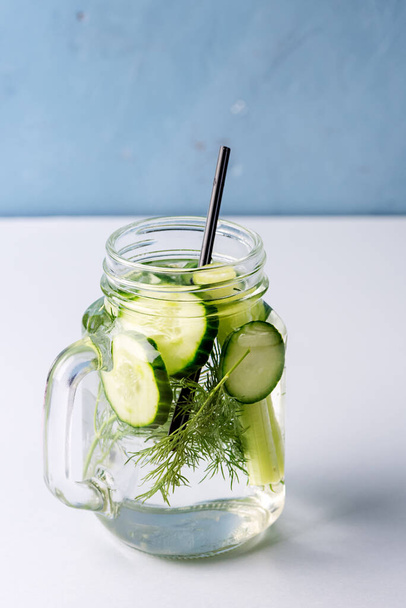 Glass Jar of Tasty Fresh Infused Water Made With Organic Vegetable Cucumber and Celery Healthy Detox Drink - Zdjęcie, obraz