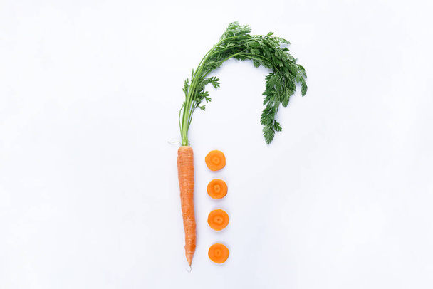 Flat lay composition with ripe fresh carrots on white background. - Fotografie, Obrázek