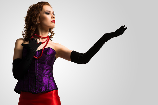 woman in corset and red dress - Fotó, kép