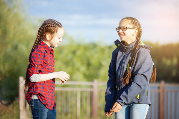 Two teenage girls spend some time outdoors. - Photo, image