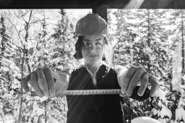 construction woman holding tape measure - Photo, Image
