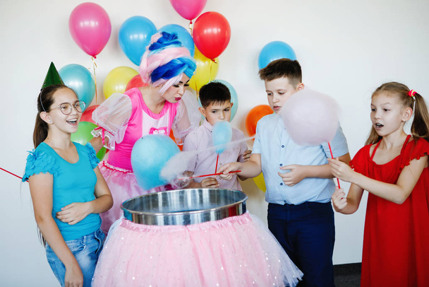 Group of children and teens with cotton candy at celebration. and holiday. - Φωτογραφία, εικόνα
