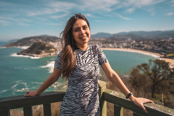 fashion portrait of attractive young woman at viewpoint of Igeldo de San Sebastian - Photo, image