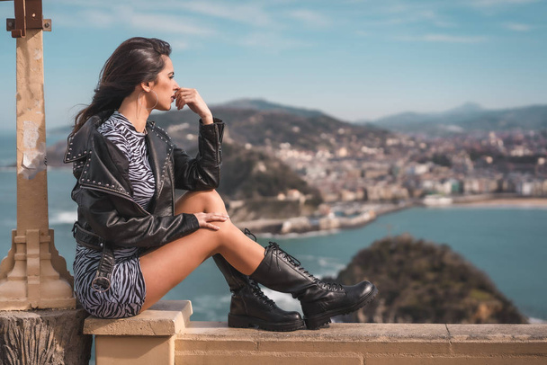 fashion portrait of attractive young woman at viewpoint of Igeldo de San Sebastian - Photo, image
