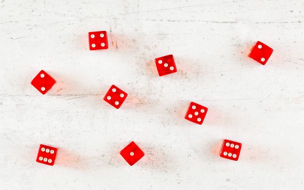 Overhead shot - red craps dices on white board showing different numbers - Фото, изображение