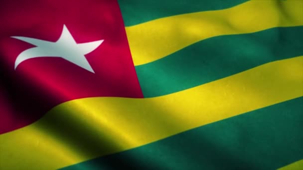 Togo vlag wapperend in de wind. Nationale vlag van Togo. Teken van Togo naadloze lus animatie. 4K - Video