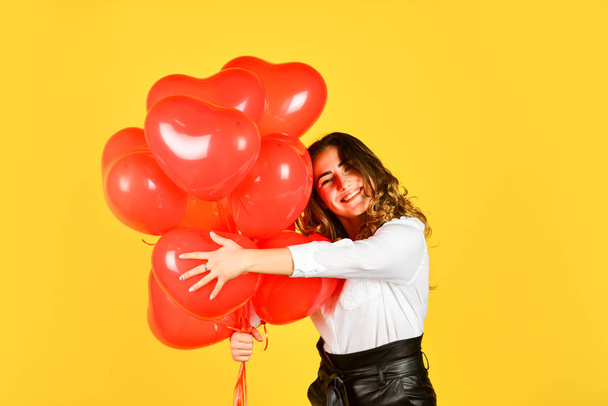 Surprise with love. Helium balloons for party. Impressive present. Happy valentines day. Birthday party. Girl heart balloons. Gift for girlfriend. Festive mood. Happy woman air balloons bunch gift - Φωτογραφία, εικόνα