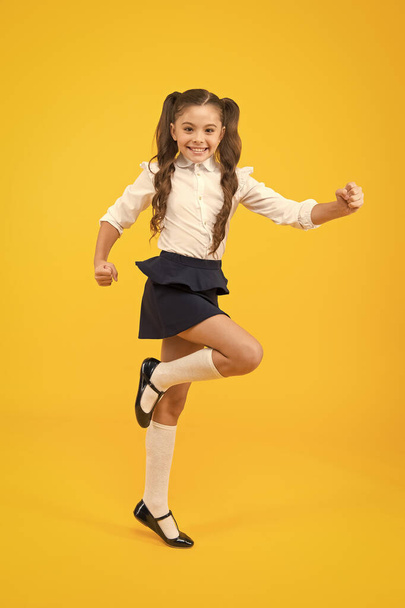 Keep going. Active kid. Girl on way knowledge. Knowledge day. Back to school. Kid cheerful schoolgirl running. Pupil want study. Active child in motion. Freedom concept. Knowledge determined success - 写真・画像
