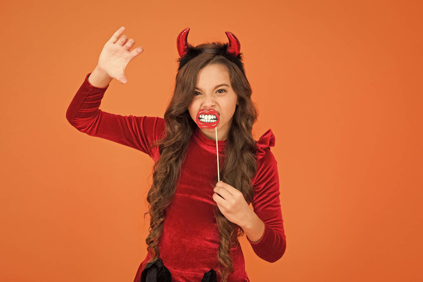 Vampire teeth. Little girl cute small horns celebrate Halloween. Carnival concept. Small child imp style accessory. Halloween party. Trick or treat concept. Halloween costumes. Photo booth props - Fotó, kép