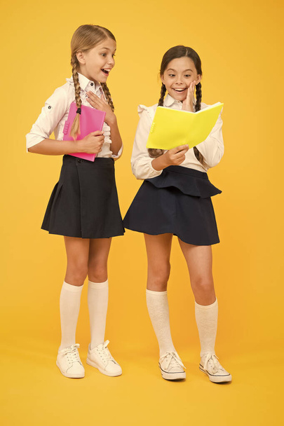 School friendship. Most important thing one learns in school is self esteem support and friendship. Friendship goals. Cute school girls with books. First day at school. Sharing gossips personal diary - Photo, Image