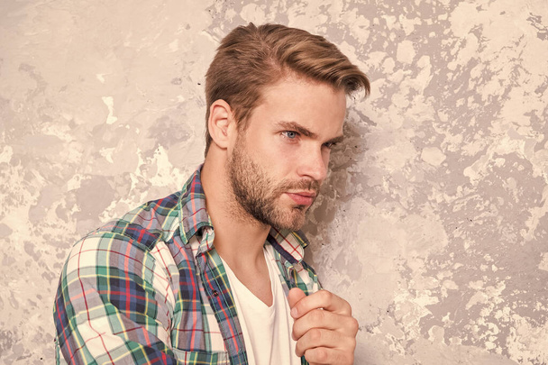 having some thoughts. mens sensuality. sexy guy casual style. macho man grunge background. male fashion collection. charismatic student checkered shirt. unshaven man care his look. barbershop concept - Fotografie, Obrázek