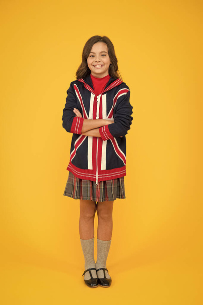 british school in england. vacation in great britain. travel concept. Union Jack Flag. small girl uniform. kid with english flag on jacket. go study to england. learn english language - Photo, image