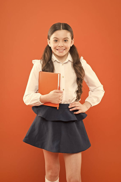 Inspiration for study. Back to school. Knowledge day. Possible everything. Schoolgirl enjoy study. Kid school uniform hold workbook. School lesson. Child doing homework. Your career path begins here - Photo, image