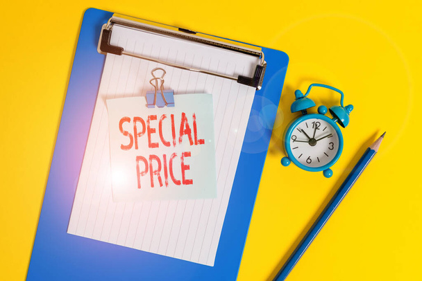 Text sign showing Special Price. Conceptual photo selling at a price that is lower than usual Discounted Clipboard paper sheet note binder pencil alarm clock colored background. - Photo, Image