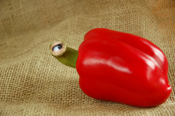 Genetically modified red pepper with eye on jute - Photo, Image