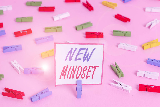 Conceptual hand writing showing New Mindset. Business photo showcasing Mental attitude or disposition New approach in dealing situation Colored clothespin papers empty reminder pink floor office. - Fotó, kép