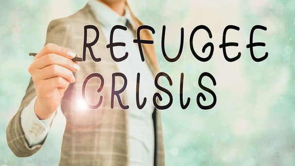 Word writing text Refugee Crisis. Business concept for refer to movements of large groups of displaced showing. - 写真・画像