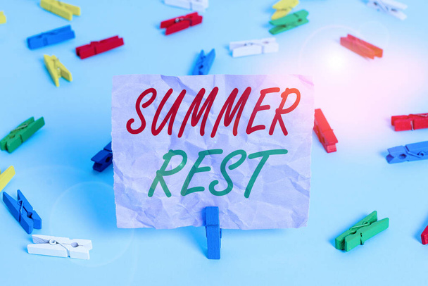 Word writing text Summer Rest. Business concept for taking holiday break or unwind from work or school during summer Colored clothespin papers empty reminder blue floor background office pin. - Φωτογραφία, εικόνα