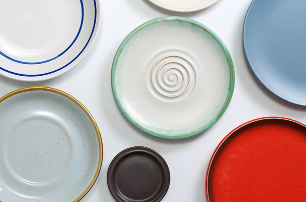 Various empty plates on white table, top view - Photo, Image