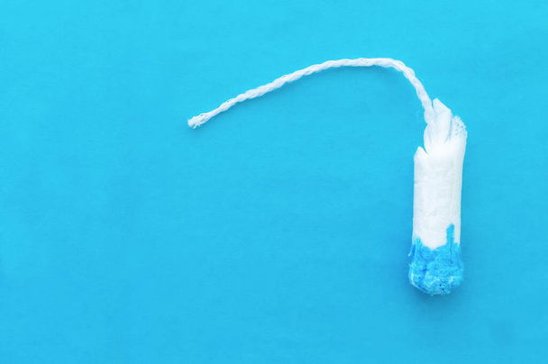 women's tampons on a blue background with a place for writing. The concept of women's health. - Foto, immagini