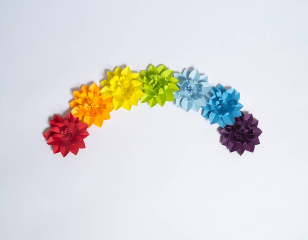 Flower made of paper. Rainbow color. Creativity is a hobby. - Foto, imagen
