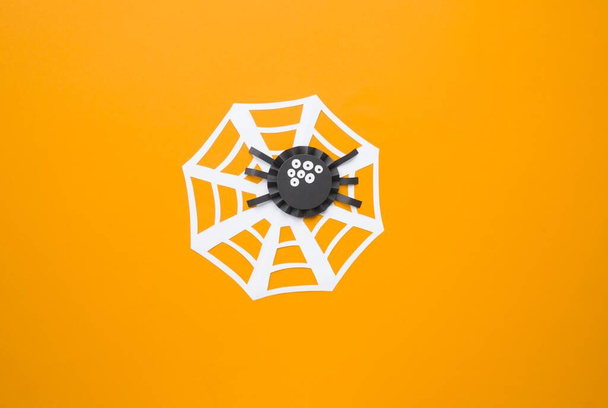 Halloween holiday spider made of paper. Children's creativity. Hobby craft material - Photo, image