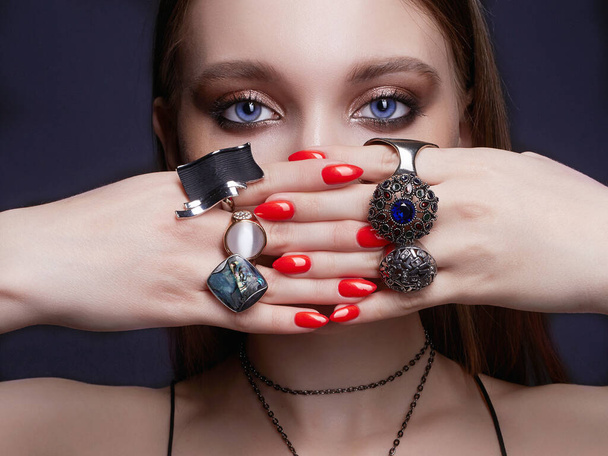 beauty woman portrait. female hands with jewelry rings. beautiful girl with make-up and manicure - Foto, Imagem