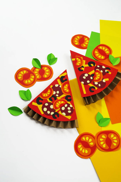 Pizza made of paper. Fast food. Hands of a child. Favorite hobby - Фото, изображение